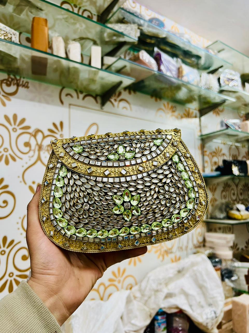 Riwaayat rhinestone kundan work brass clutch
