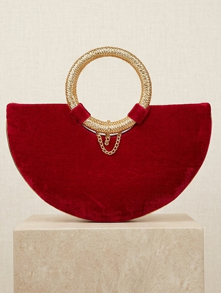 Moon clutch with golden handle and tassels