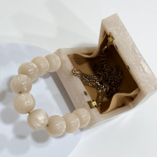 MINI off white resin clutch with pearl handle