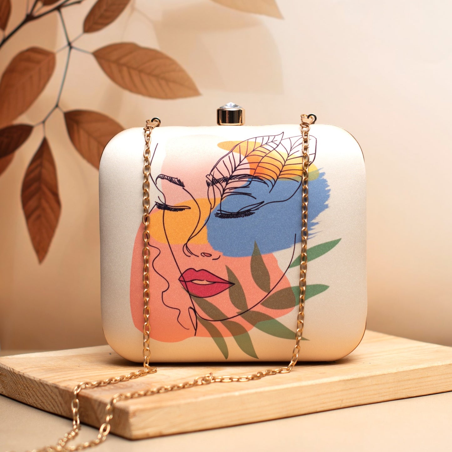 Abstract face printed fabric square clutch
