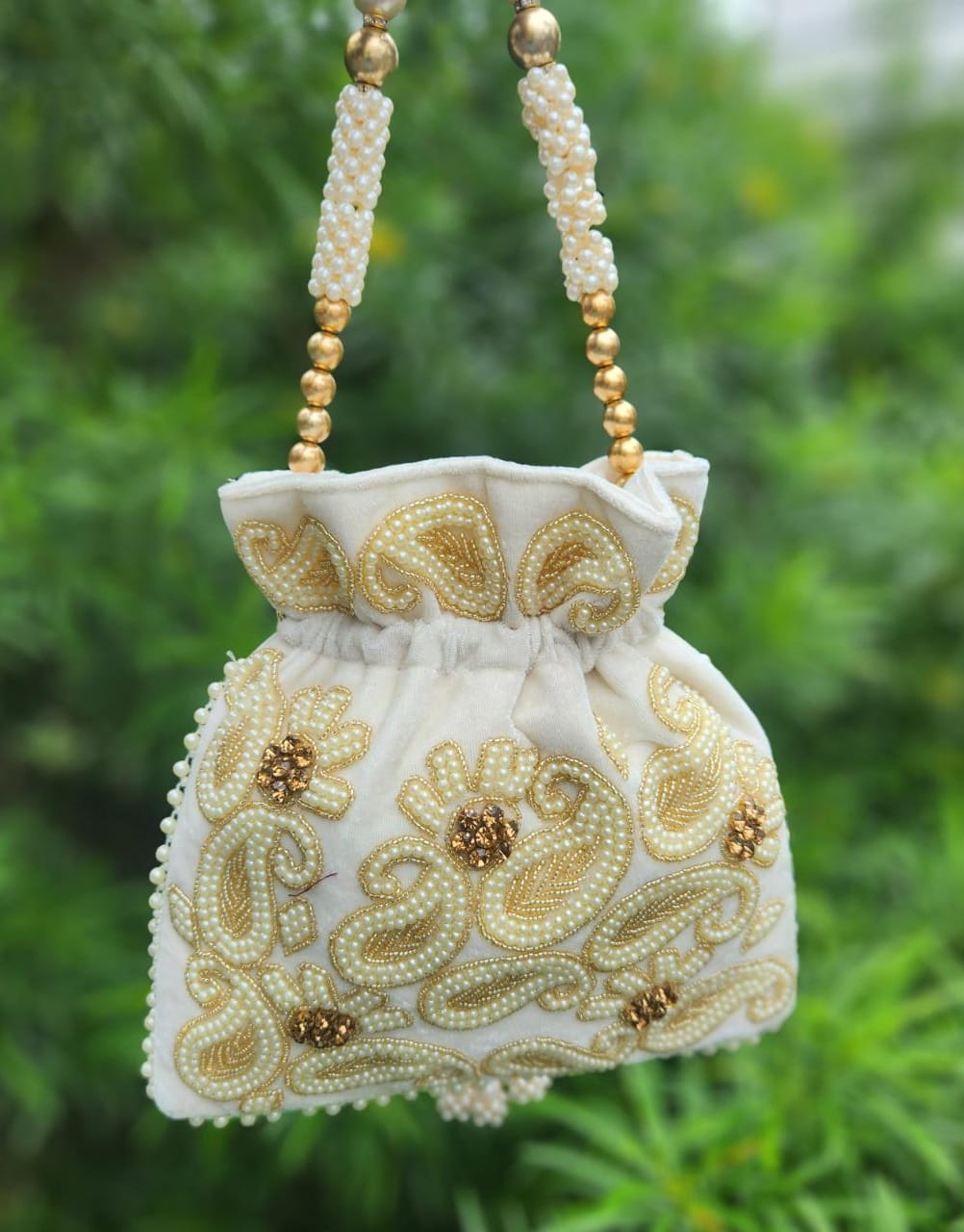 Hand embroidered pearl work potli bag - Cream