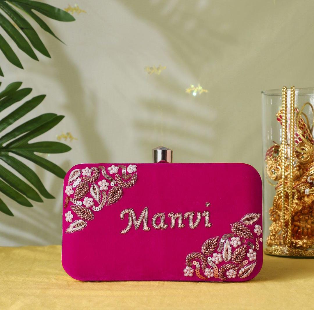 Pink clutch with golden piping work