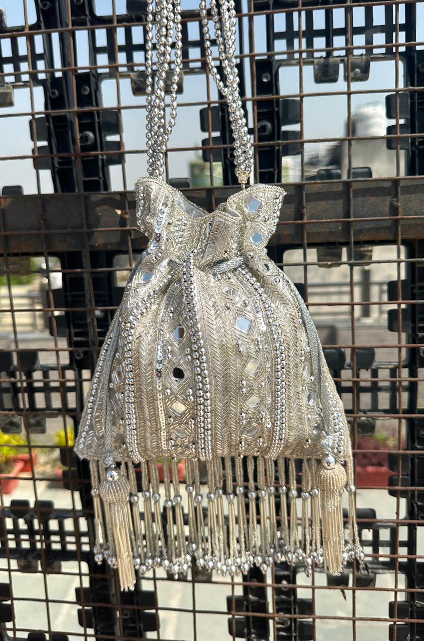 Ornate silver potli with beadwork