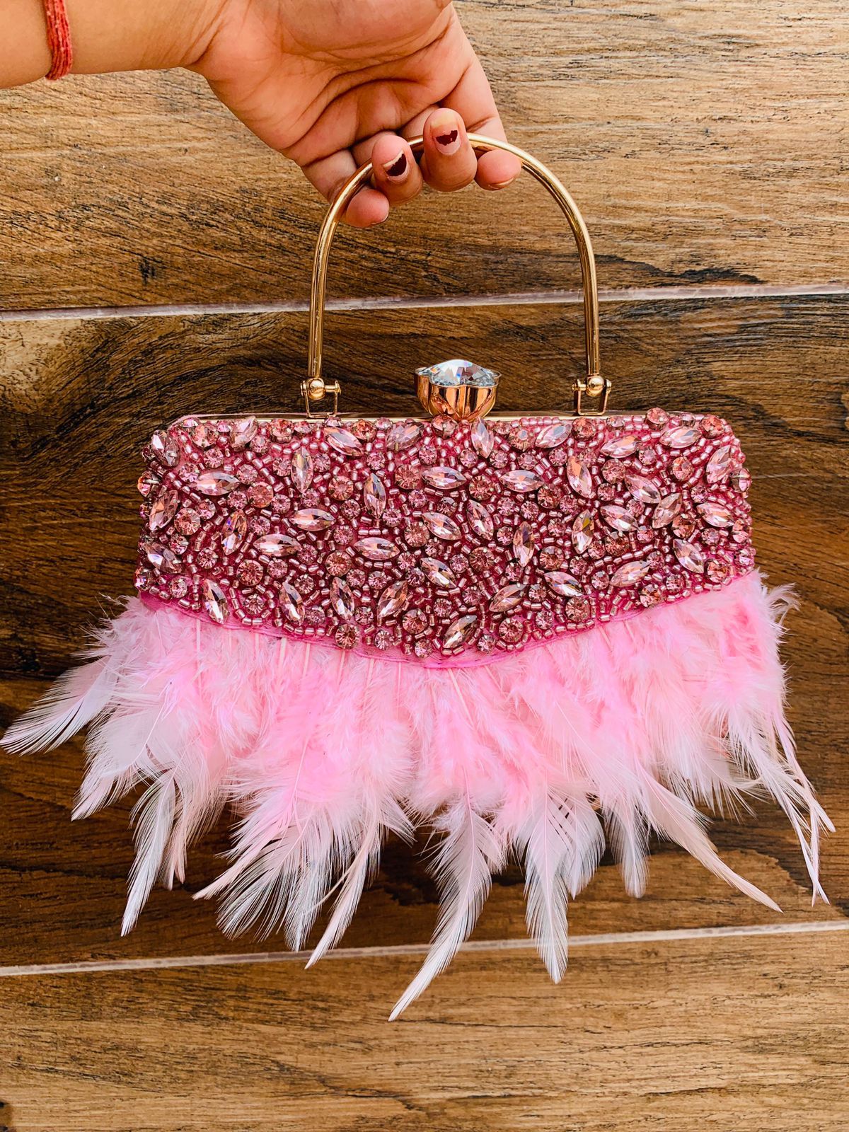 Feather work clutch with golden handle