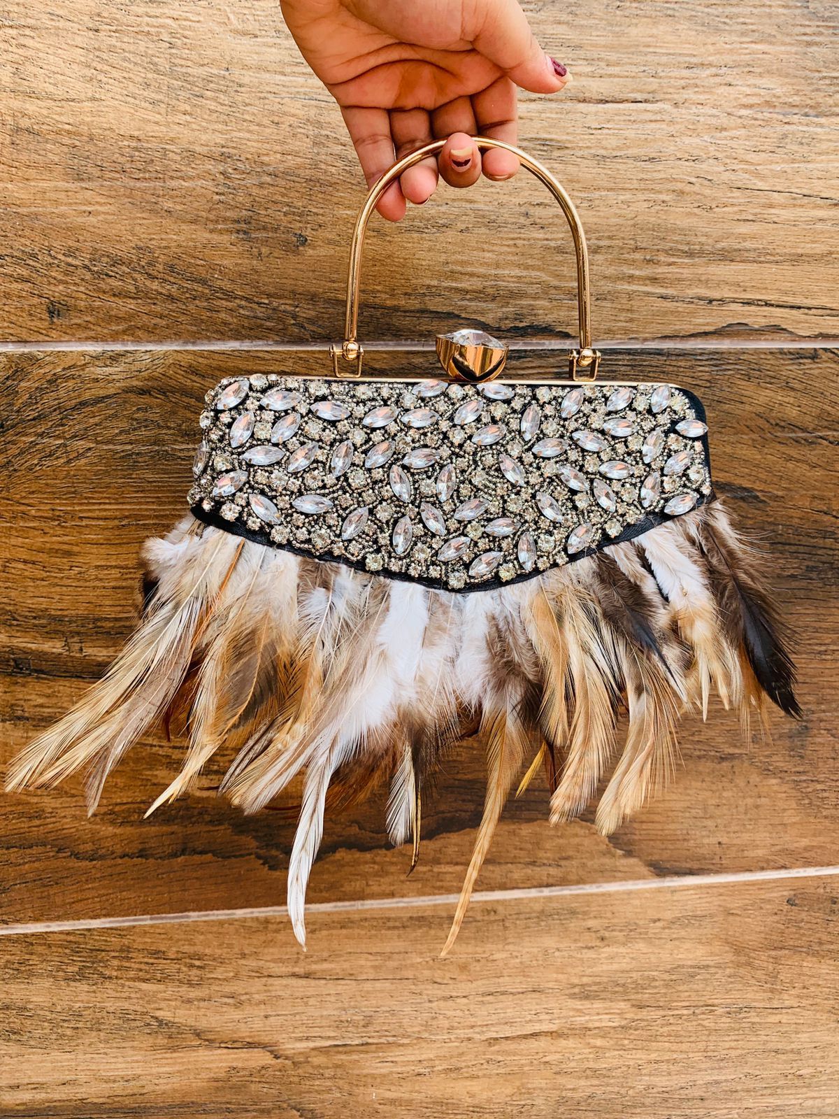 Feather work clutch with golden handle