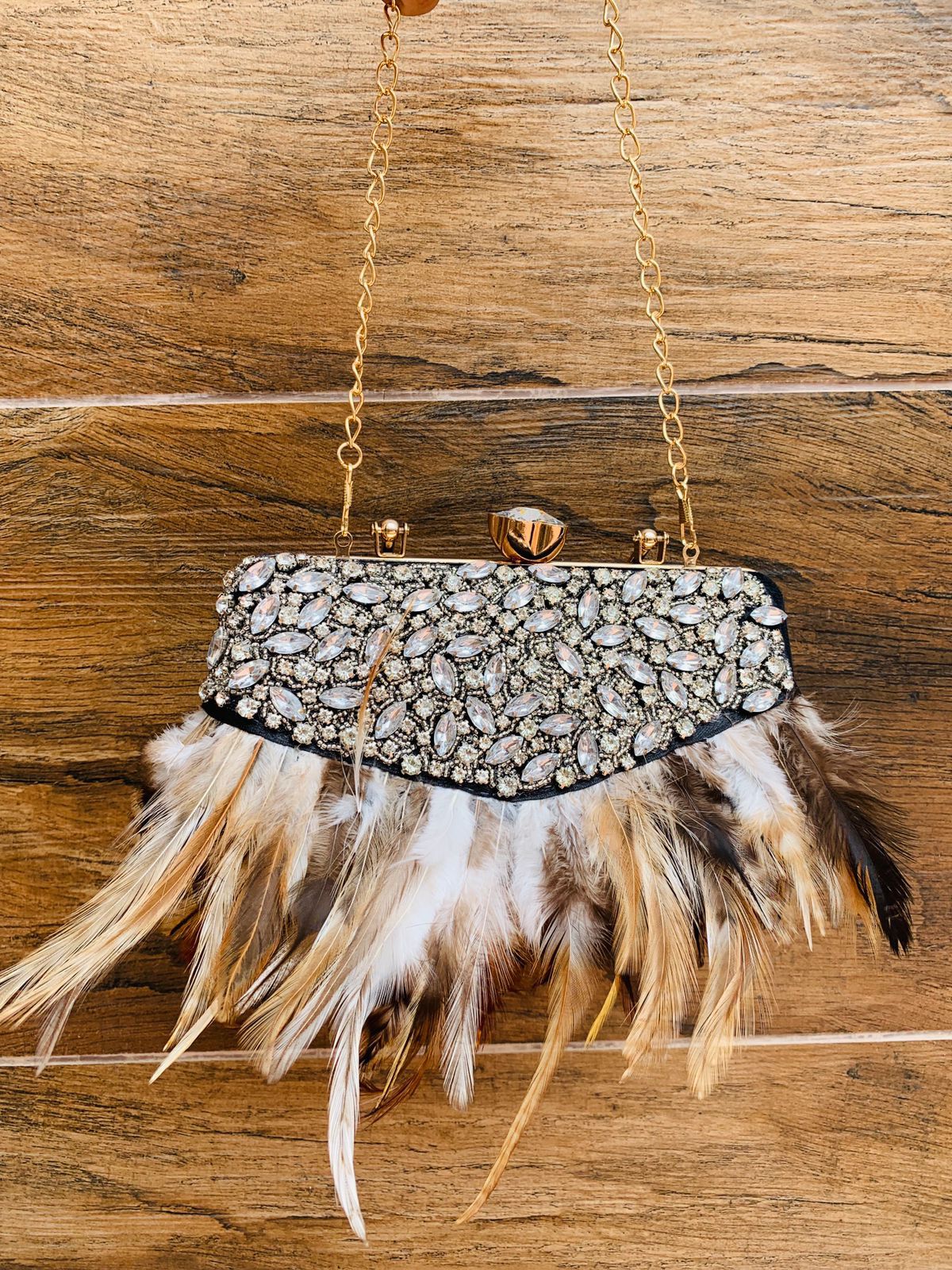 Feather work clutch with golden handle