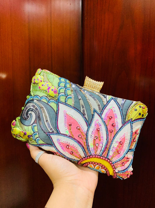Multi color printed clutch with embroidery work