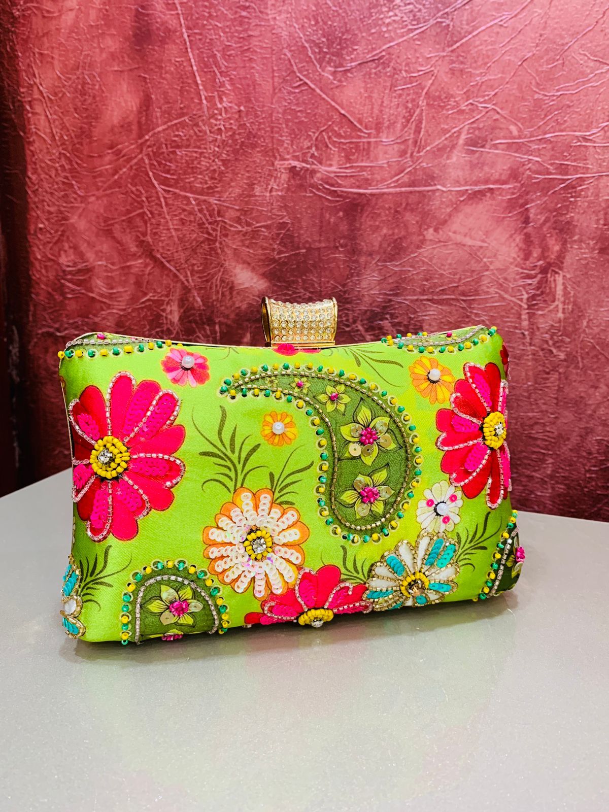 Multi color printed clutch with embroidery work