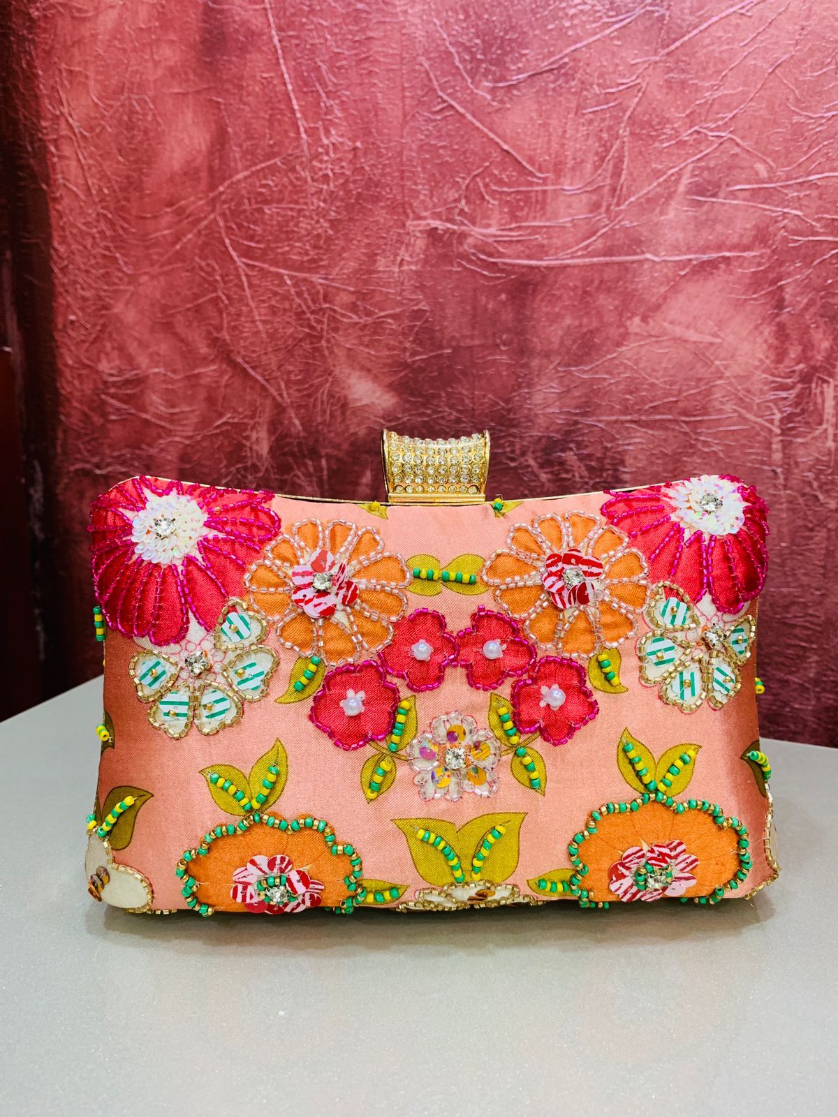 Multi color printed clutch with embroidery work