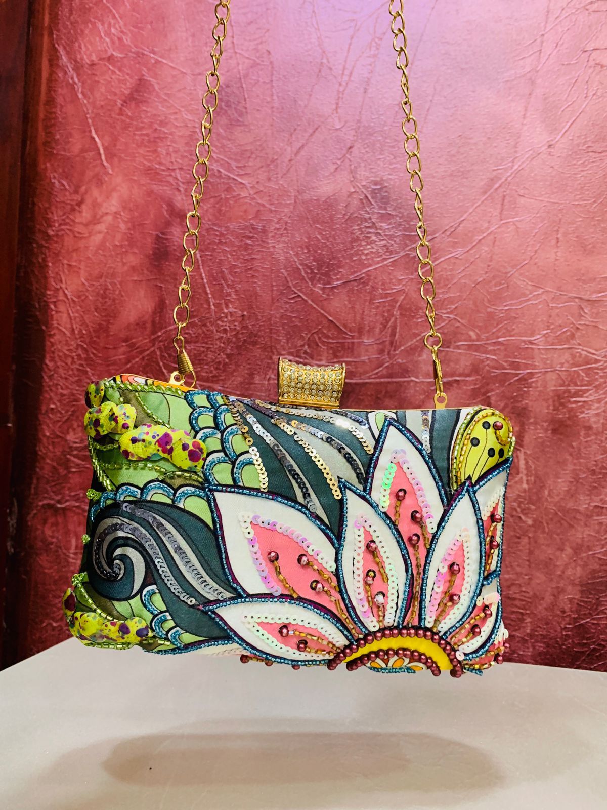 Multi color printed clutch with embroidery work