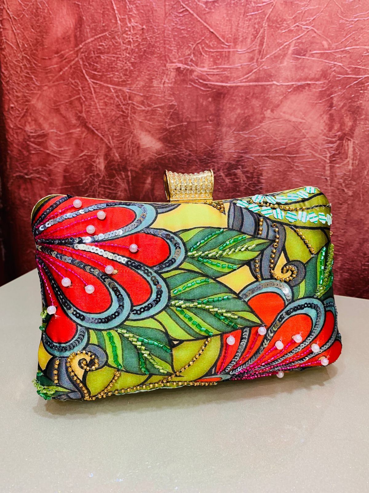 Multi color printed clutch with embroidery work