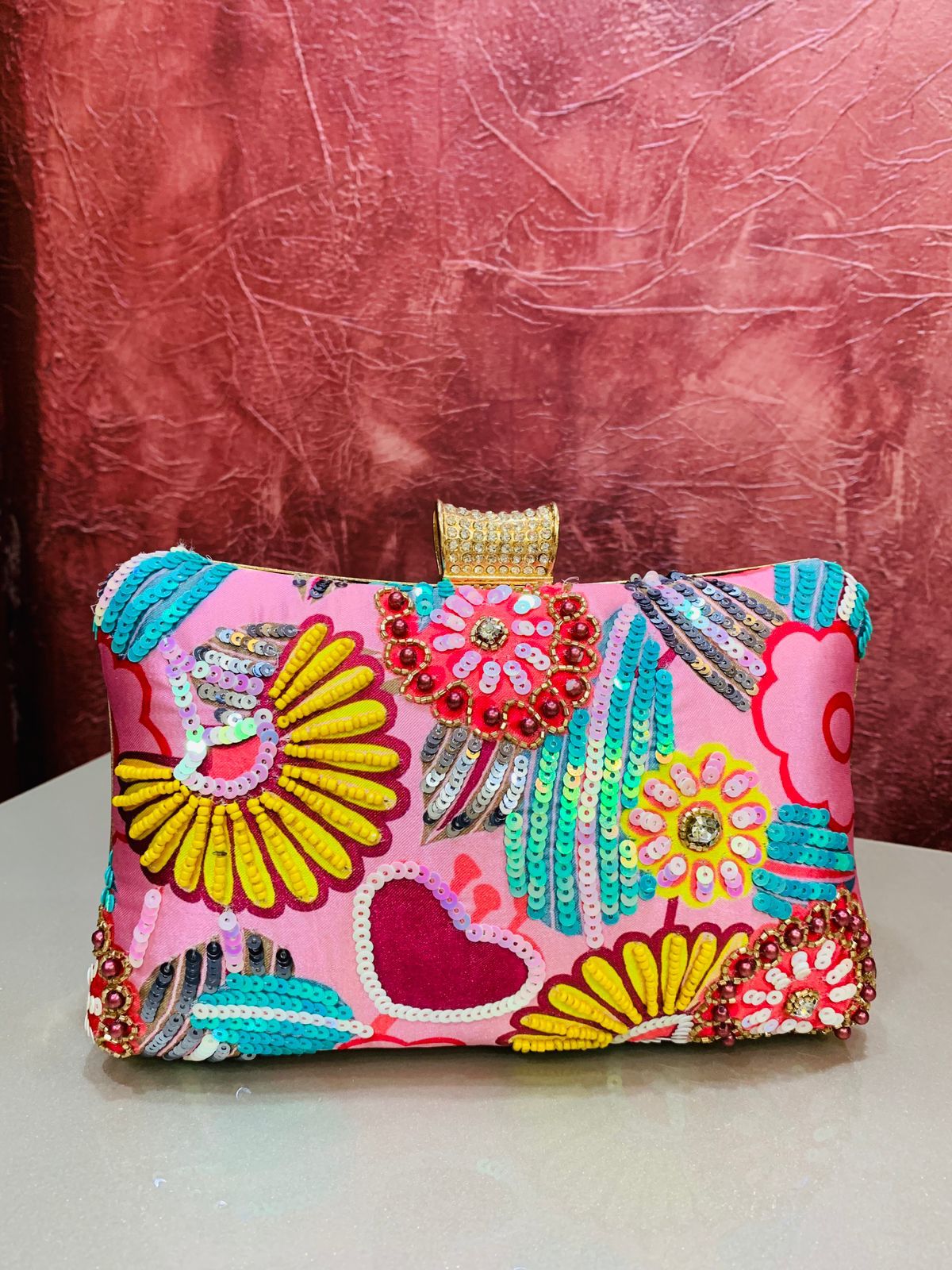 Multi color printed clutch with embroidery work