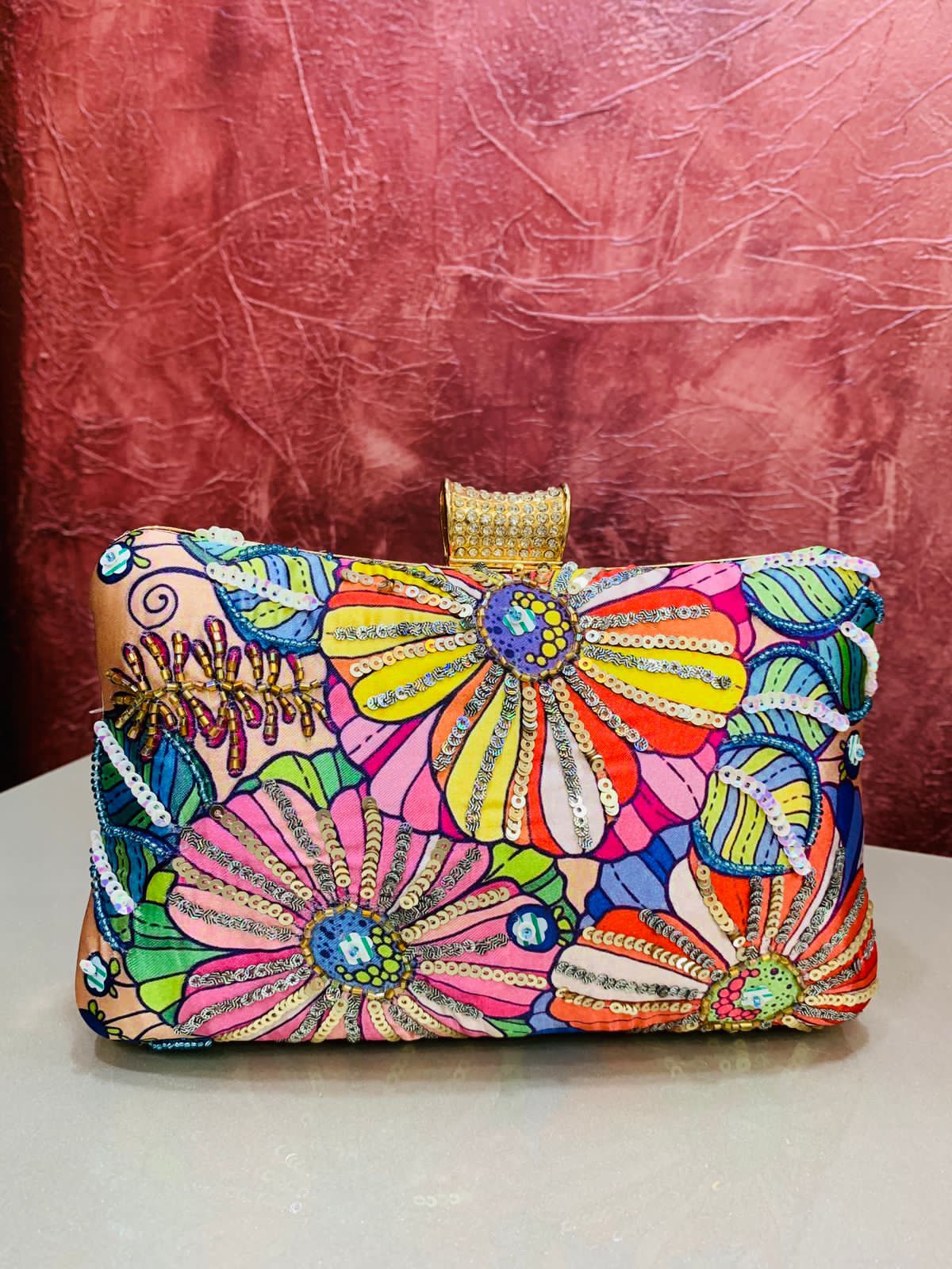 Multi color printed clutch with embroidery work
