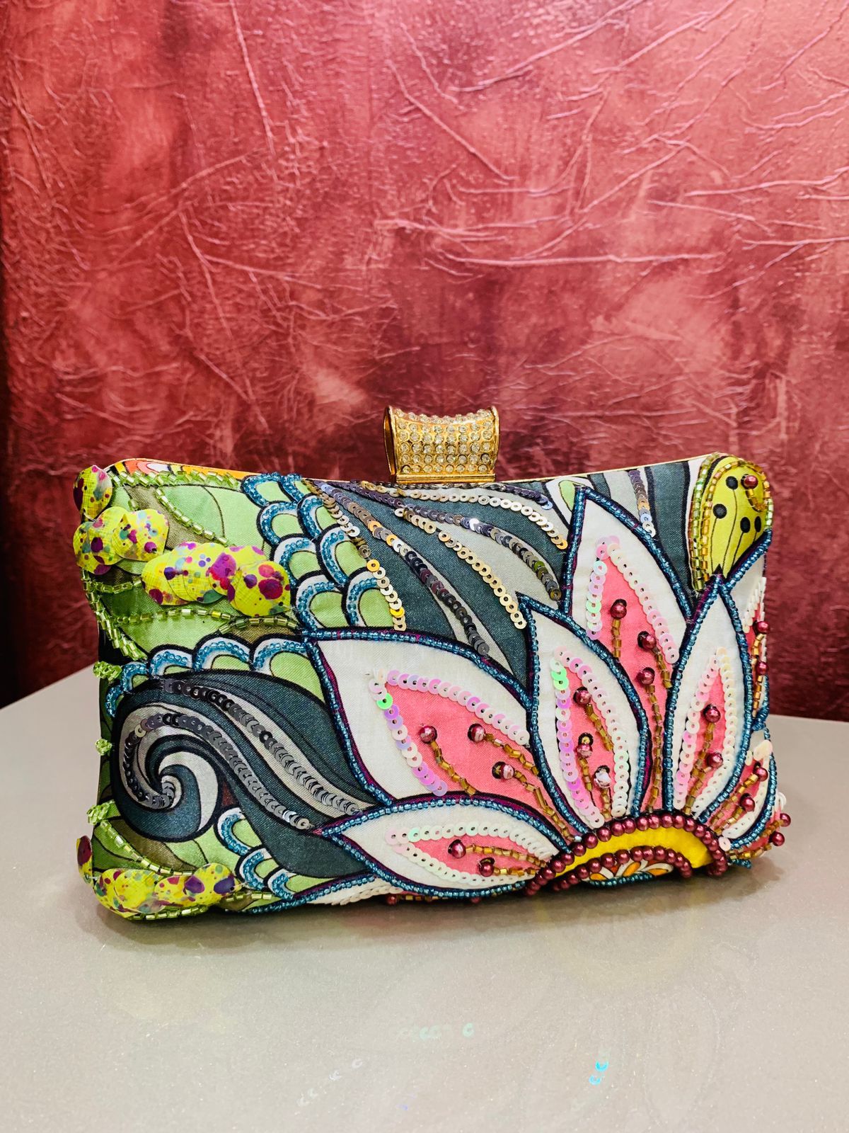 Multi color printed clutch with embroidery work