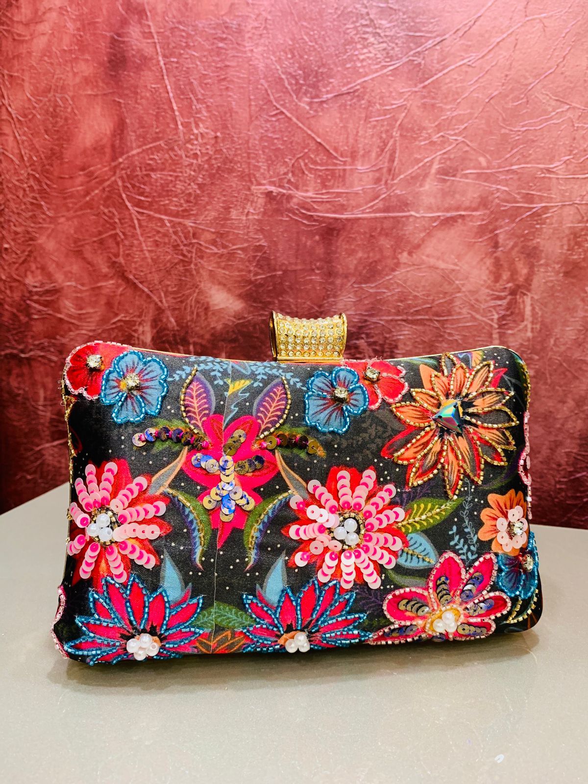 Multi color printed clutch with embroidery work
