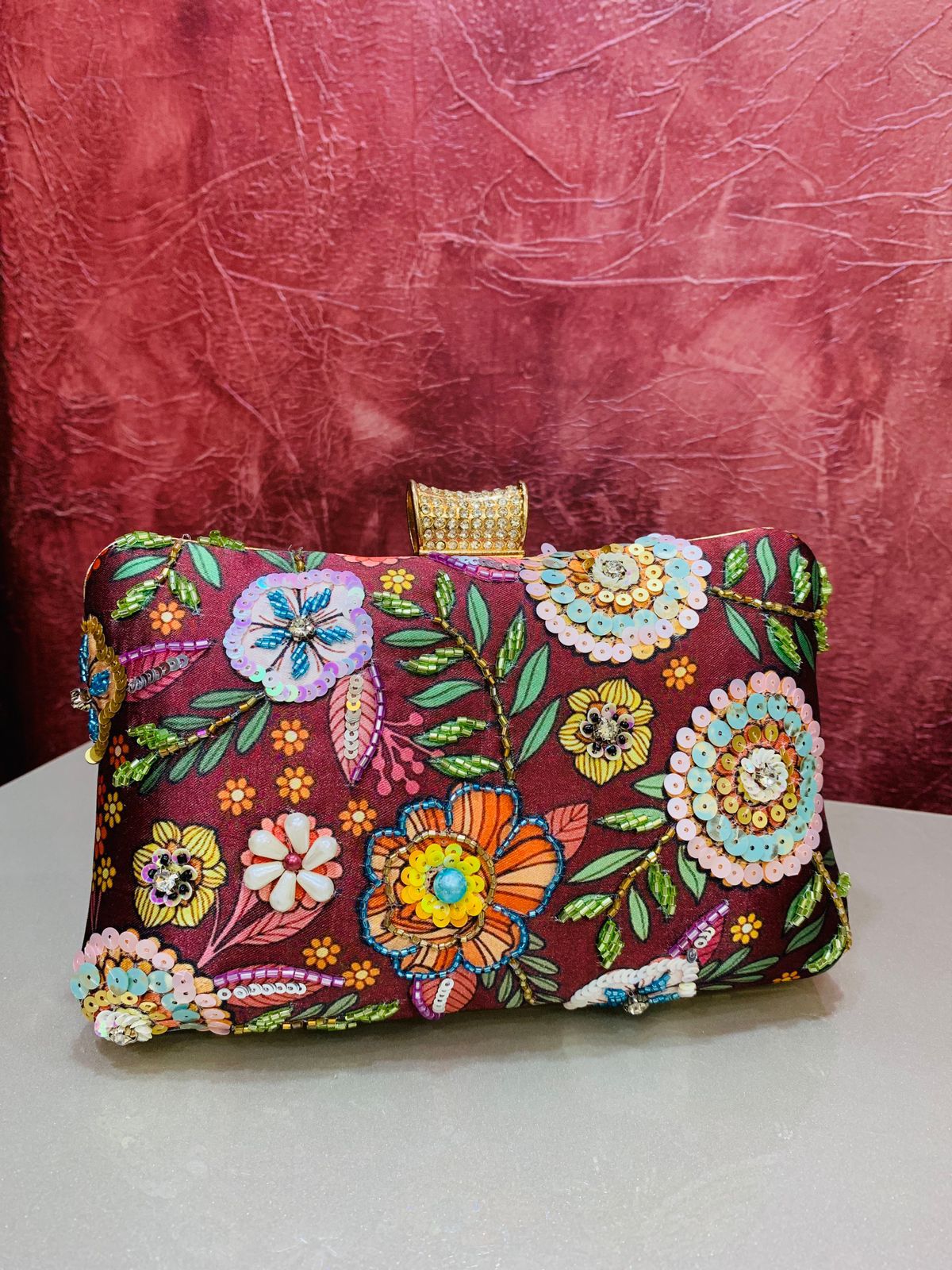 Multi color printed clutch with embroidery work