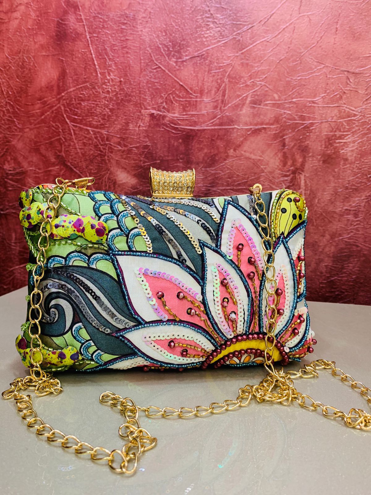 Multi color printed clutch with embroidery work