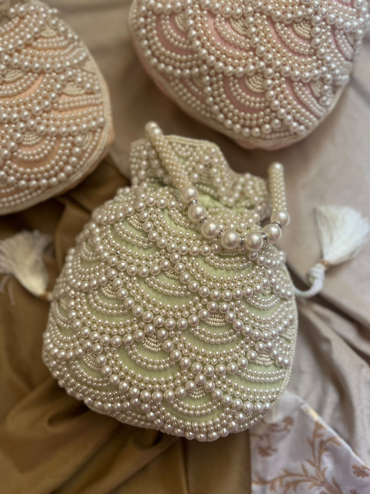 Pastel bead work potli with pearl handle