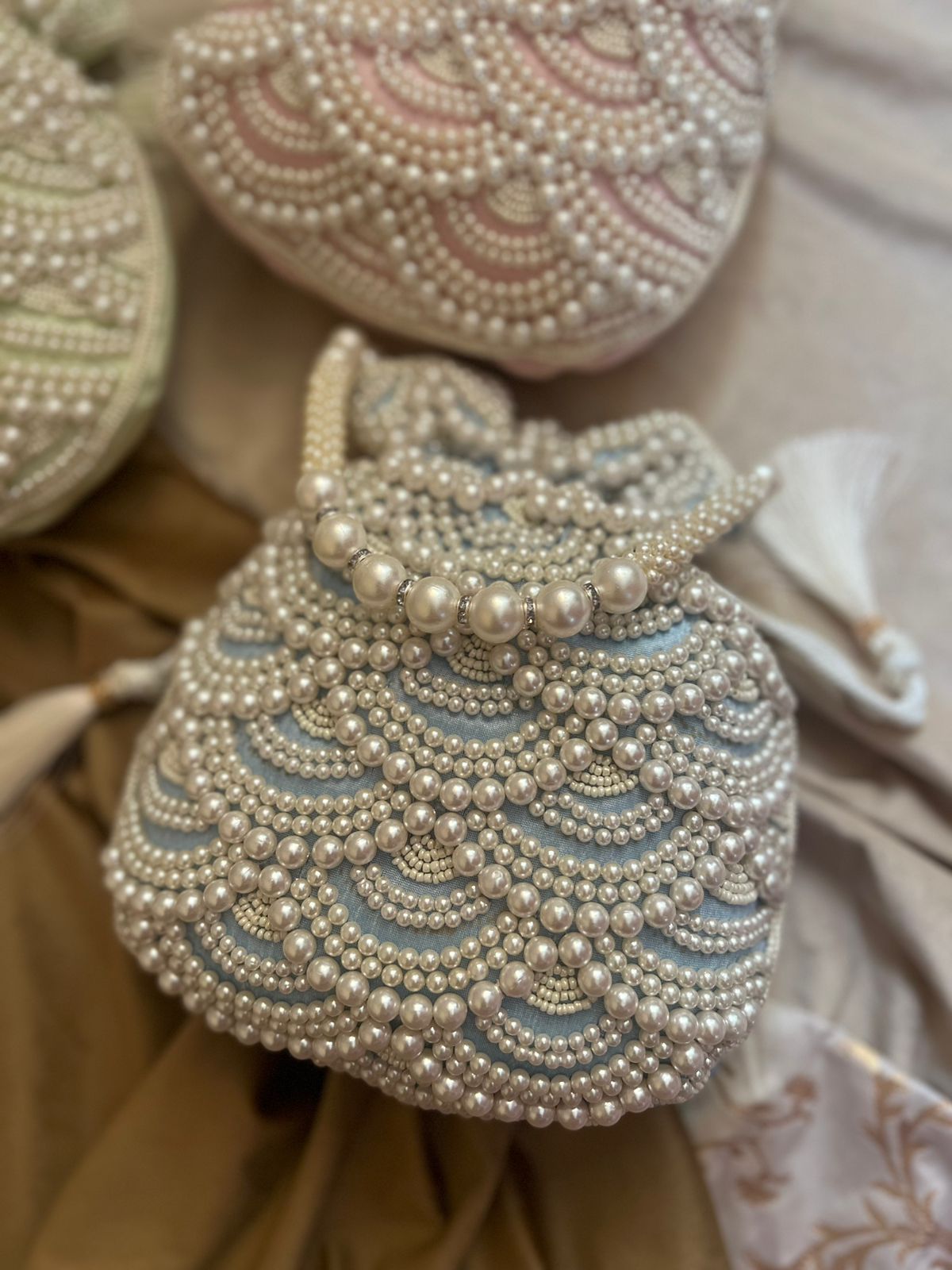 Pastel bead work potli with pearl handle