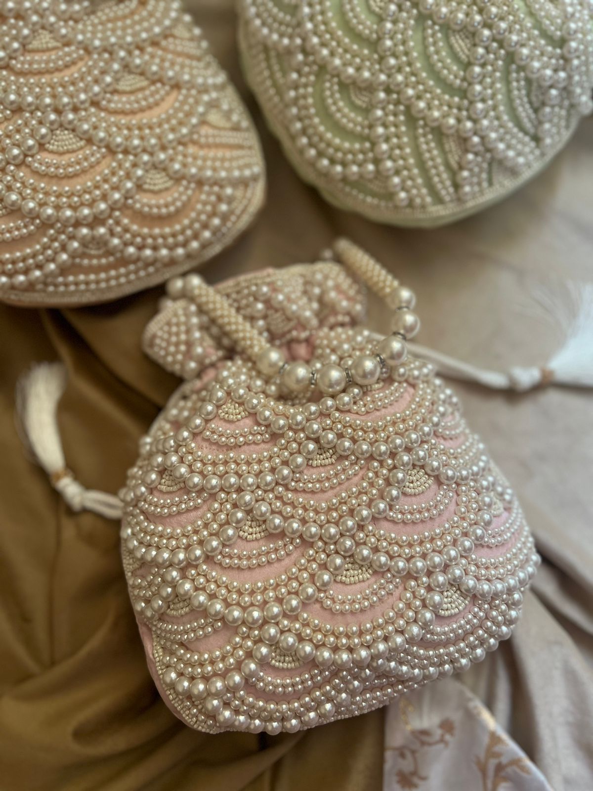 Pastel bead work potli with pearl handle