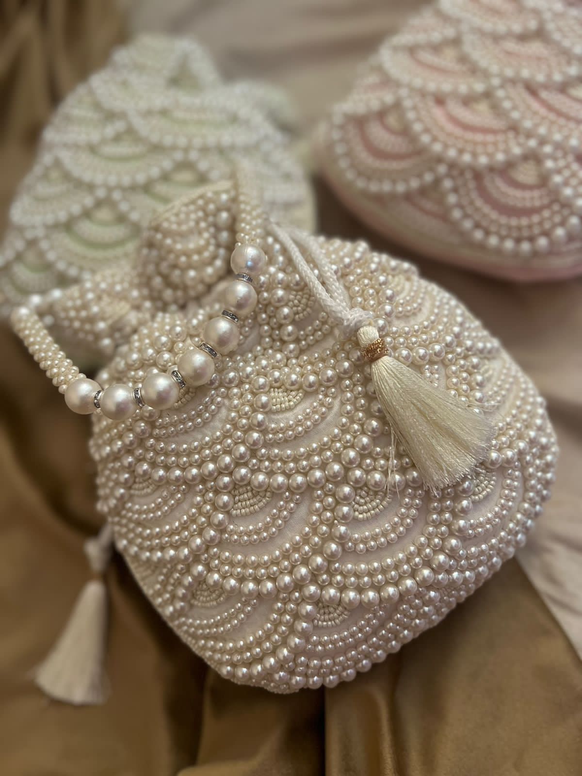 Pastel bead work potli with pearl handle