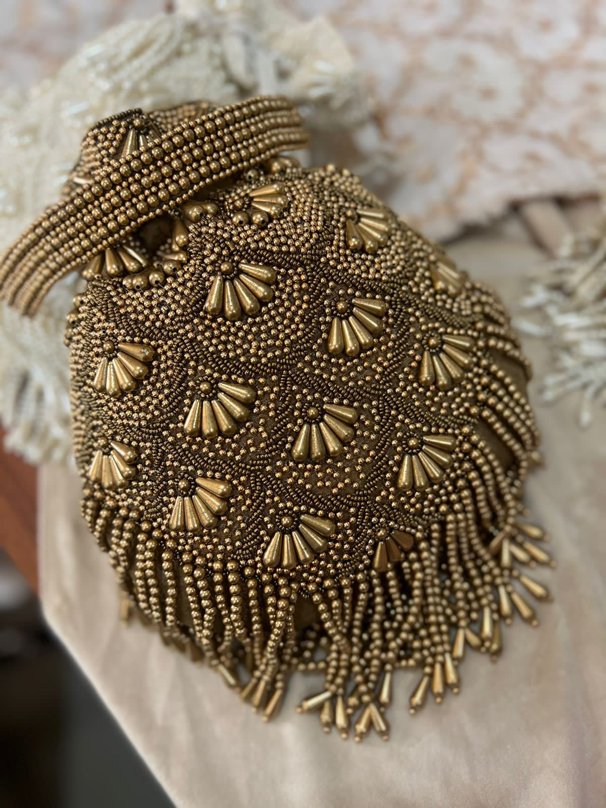 Bead work potli with pearl handle