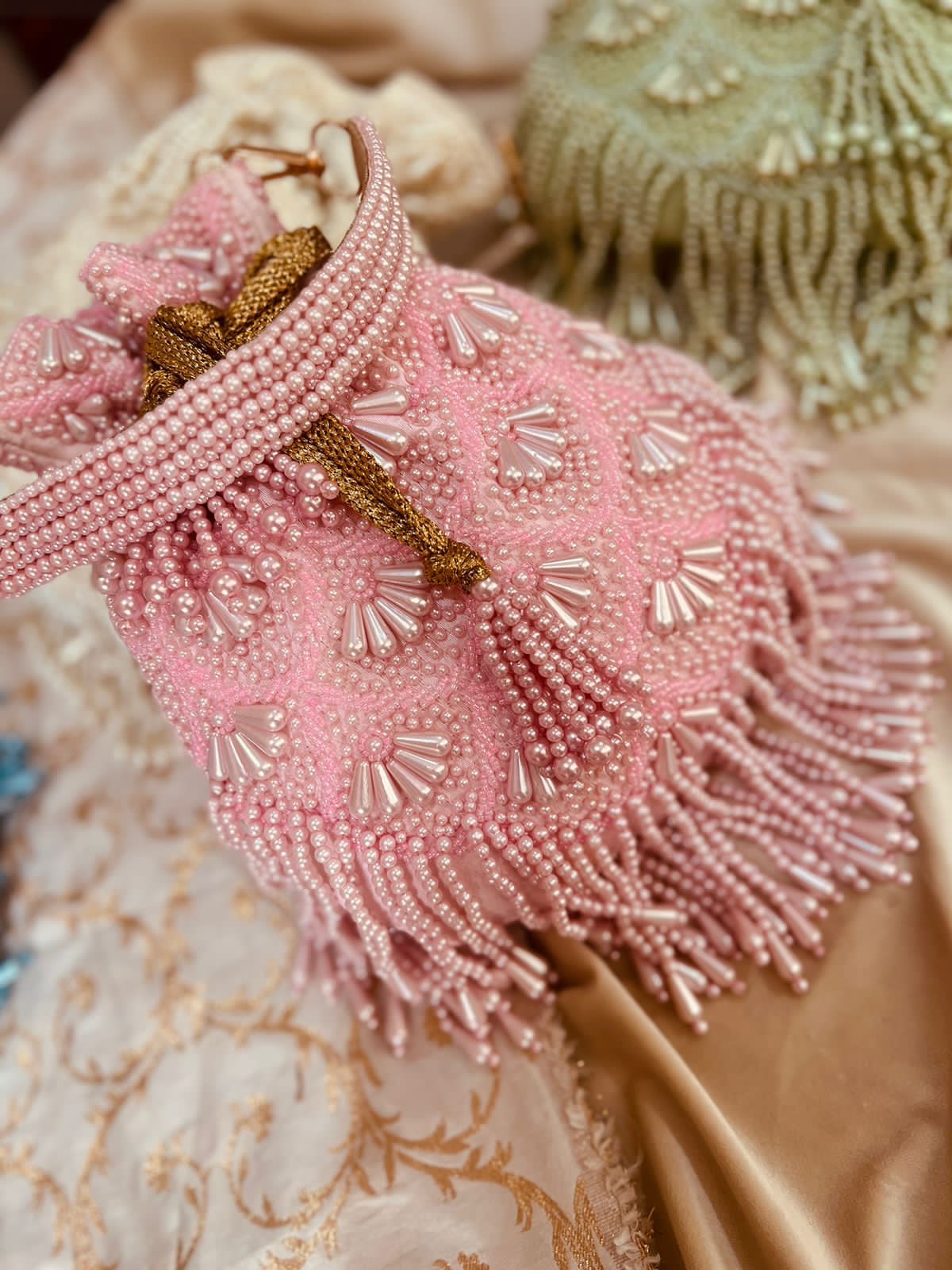 Bead work potli with pearl handle