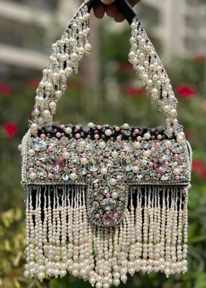 Celebrity edition mesmerizing flap clutch with matching handle