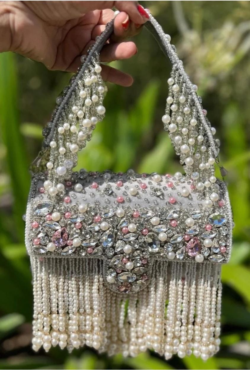 Celebrity edition mesmerizing flap clutch with matching handle