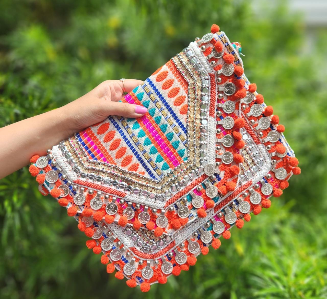 Orange boho bag with pom poms