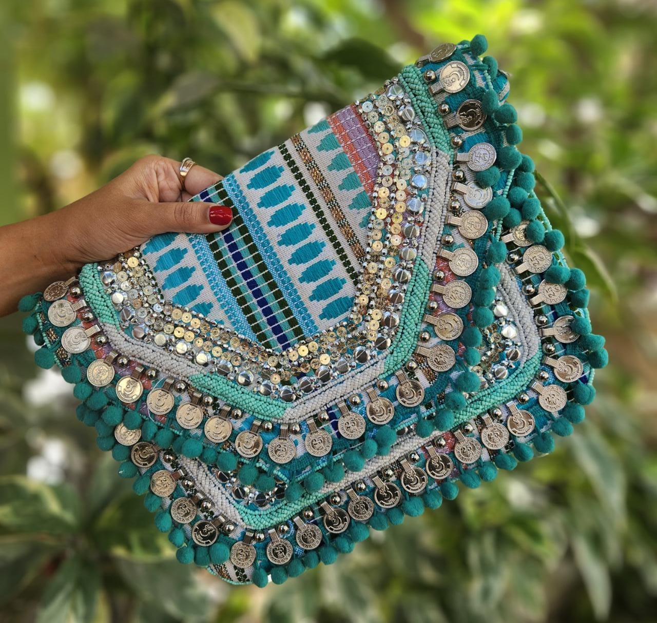 Blue boho bag with pom poms