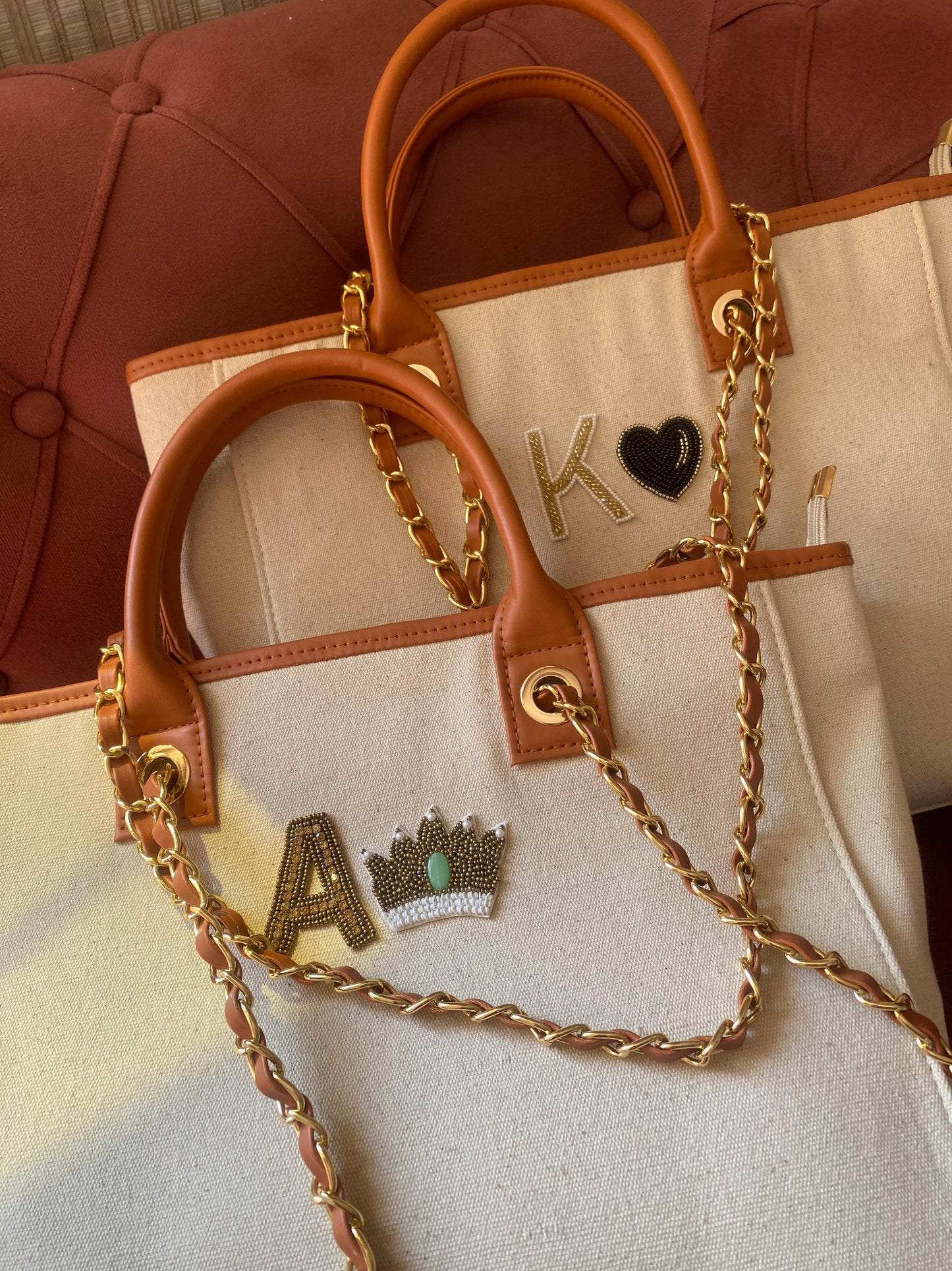 Beige canvas tote bag with crown charm