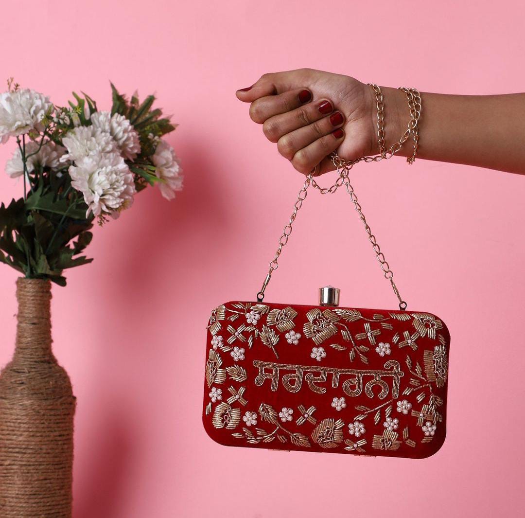Golden embroidered velvet name clutch in Punjabi
