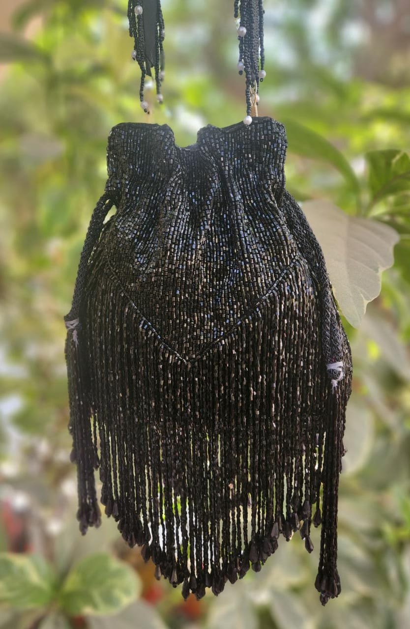 Nalki work handwork black potli with designer latkans