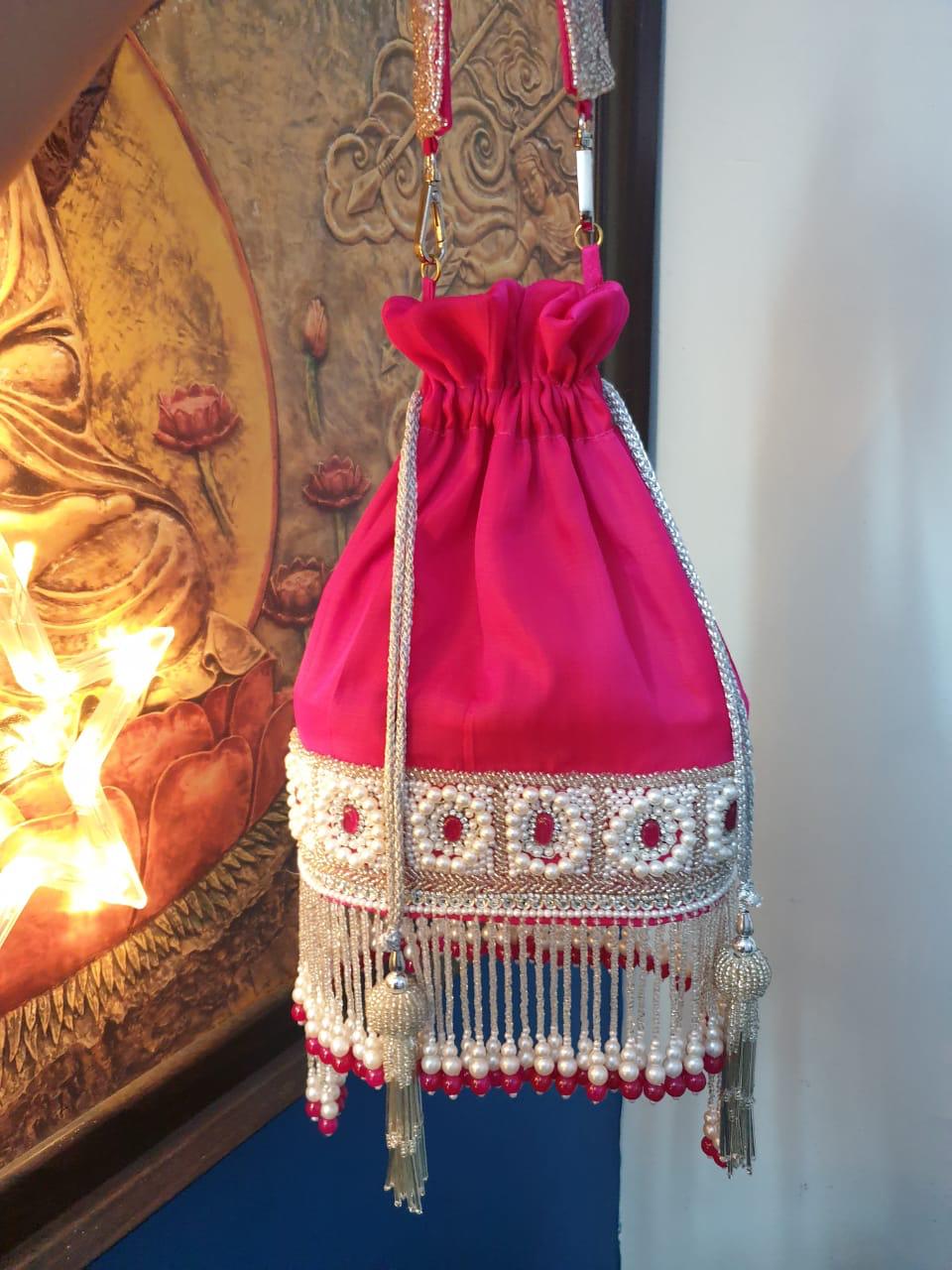 Rani pink velvet potli with white pearls