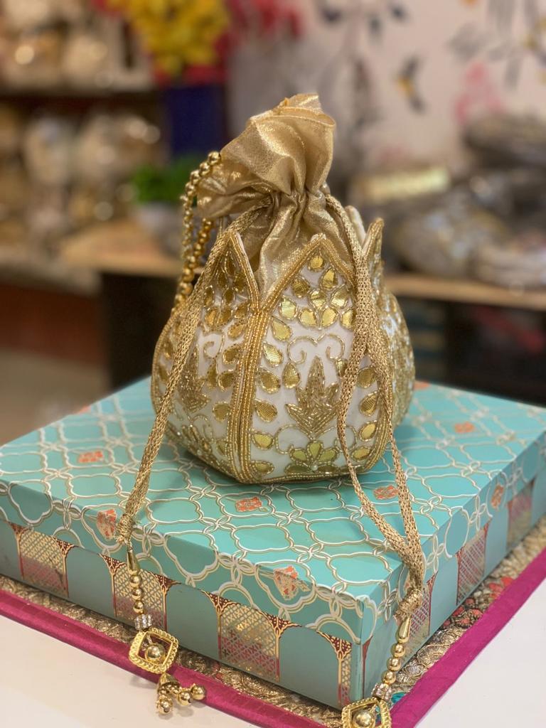 Lotus shape potli with kundan work