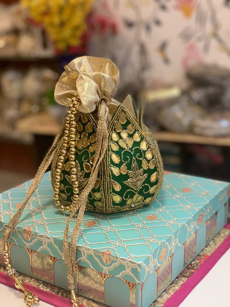 Lotus shape potli with kundan work