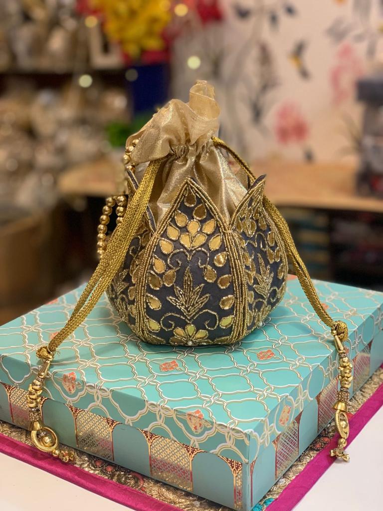 Lotus shape potli with kundan work
