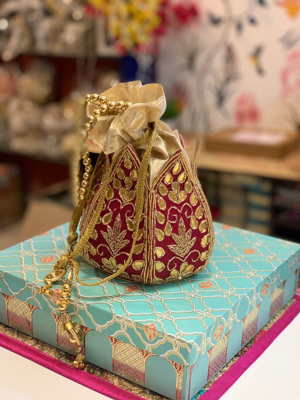 Lotus shape potli with kundan work