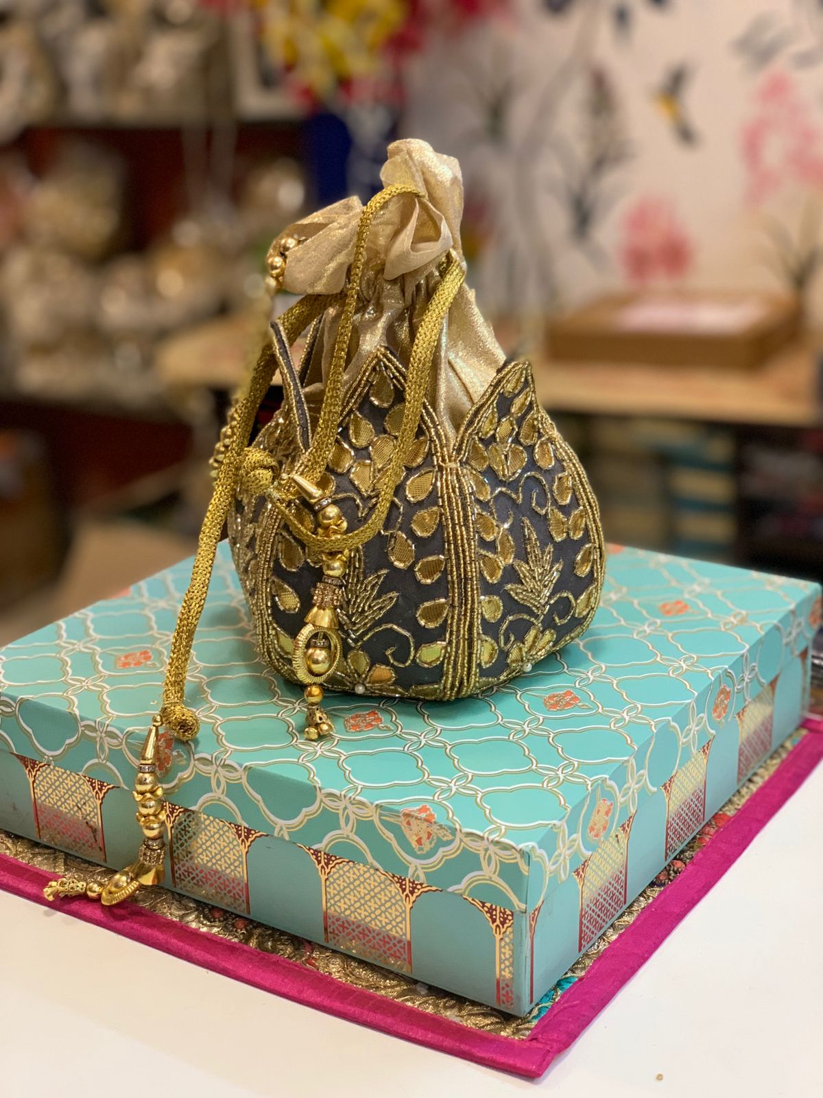Lotus shape potli with kundan work