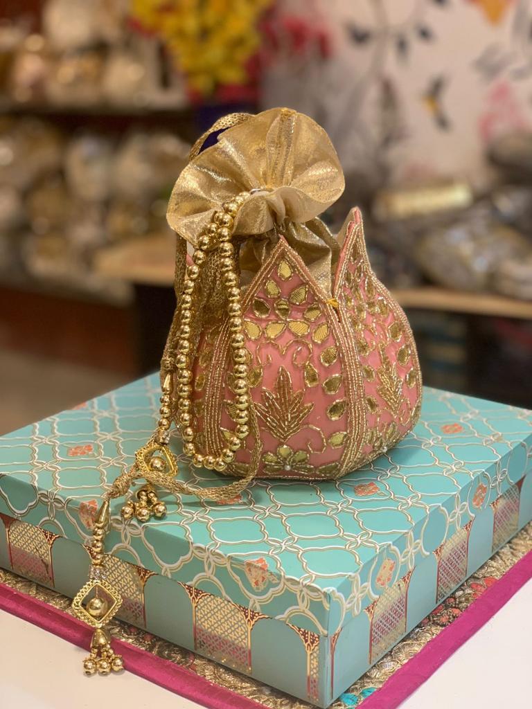 Lotus shape potli with kundan work