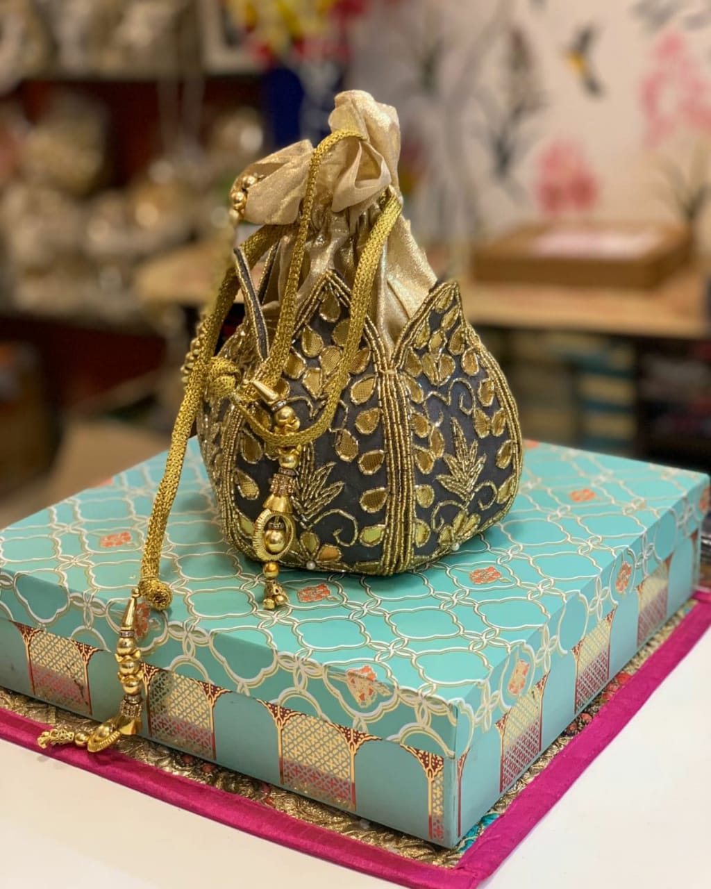 Lotus shape potli with kundan work