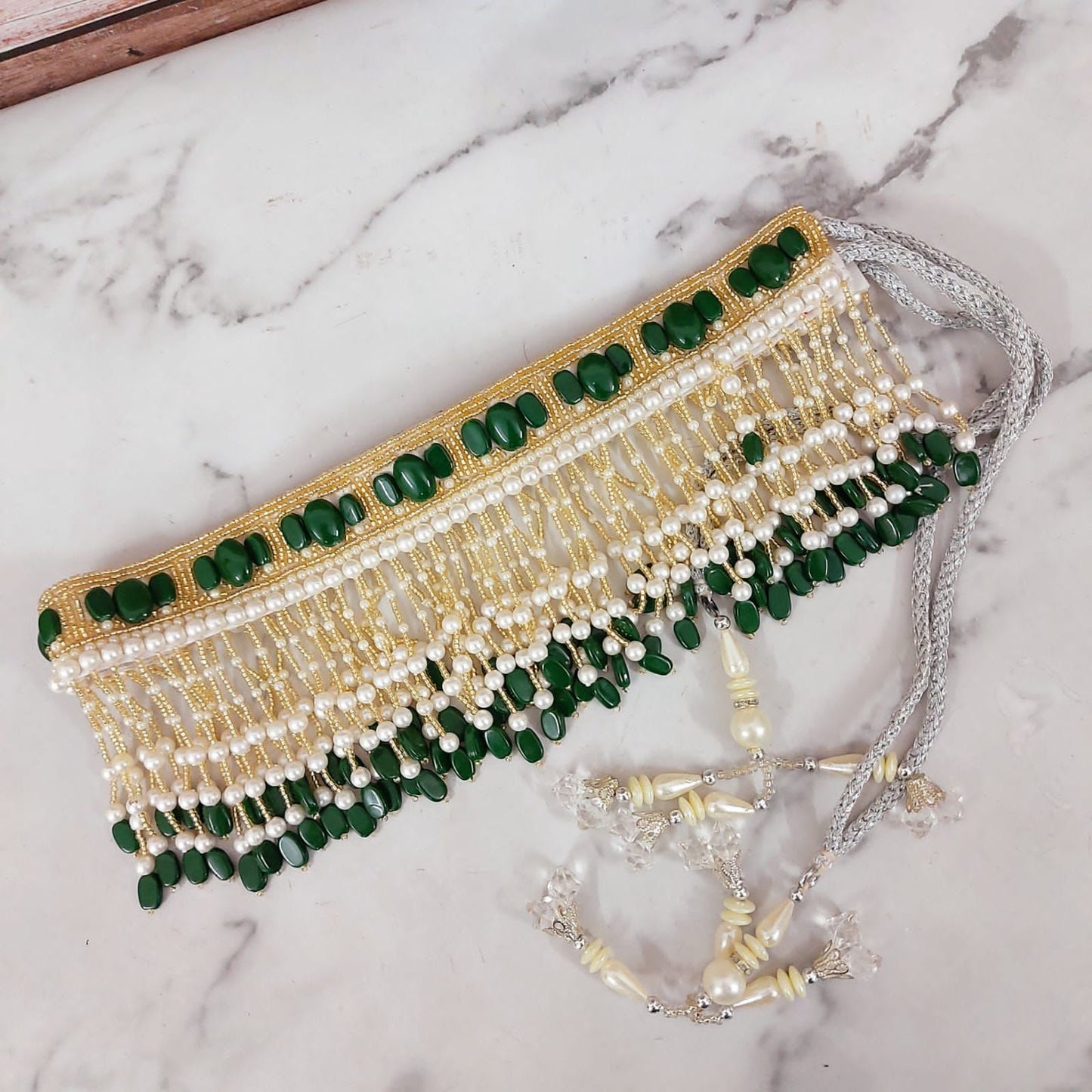 Golden waistbelt with emerald green bead work and LONG pearl drop tassel