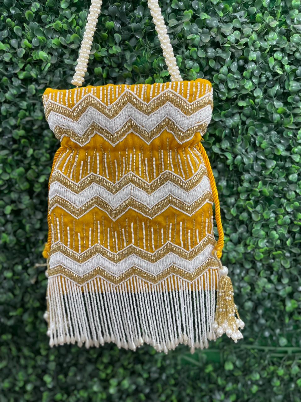 Bead work potli bag with pearl tassels