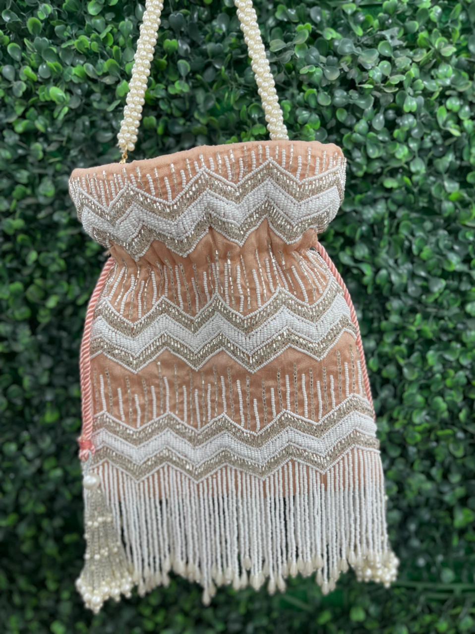Bead work potli bag with pearl tassels