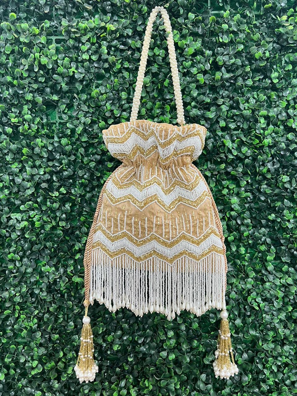Bead work potli bag with pearl tassels