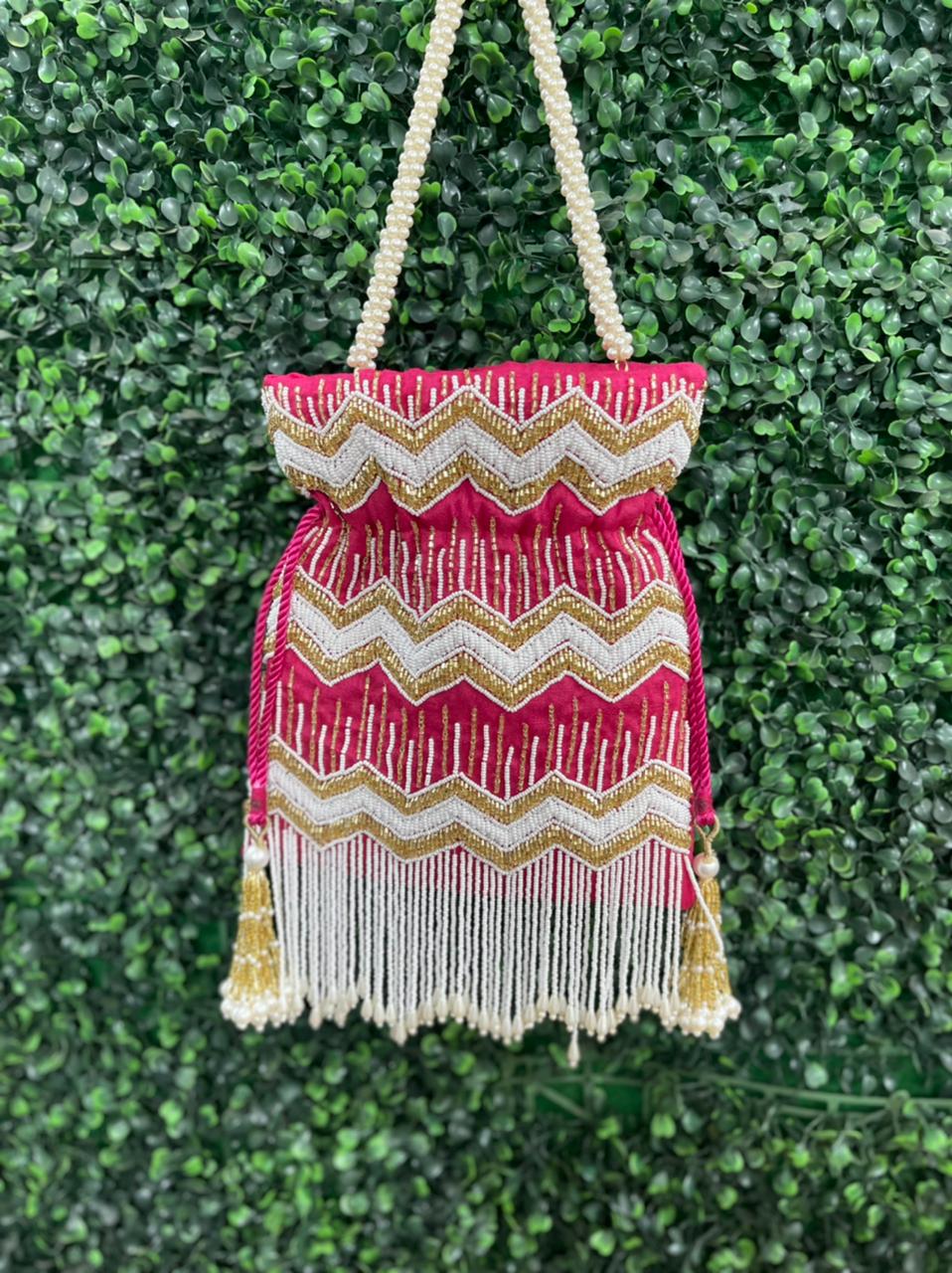 Bead work potli bag with pearl tassels