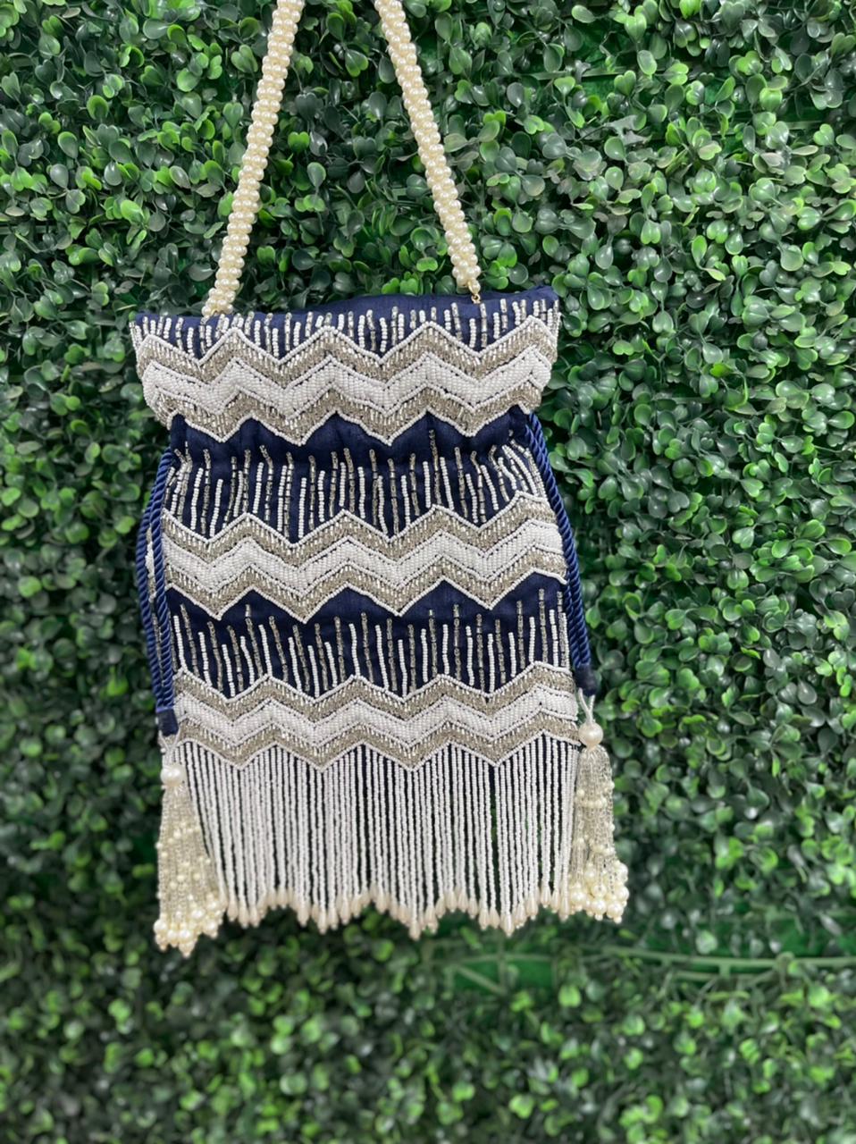 Bead work potli bag with pearl tassels