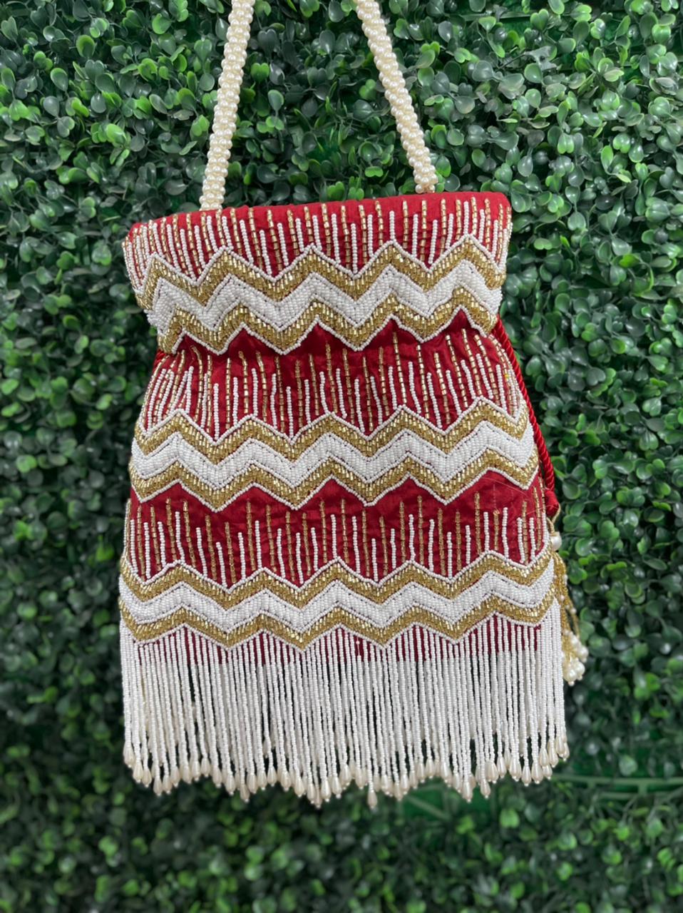 Bead work potli bag with pearl tassels