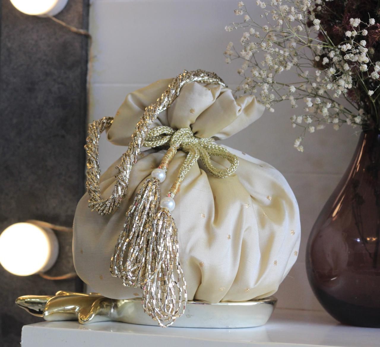 Shimmer matka potlis with pearl handle